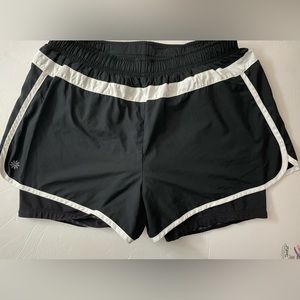 Athleta Hana 2 and 1 layered running shorts. Drawstring black size M.